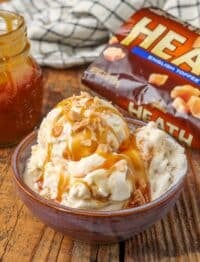 Toffee ice cream topped with toffee bits and caramel sauce