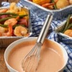 Vertical shot of Cajun Dipping Sauce with shrimp and vegetables