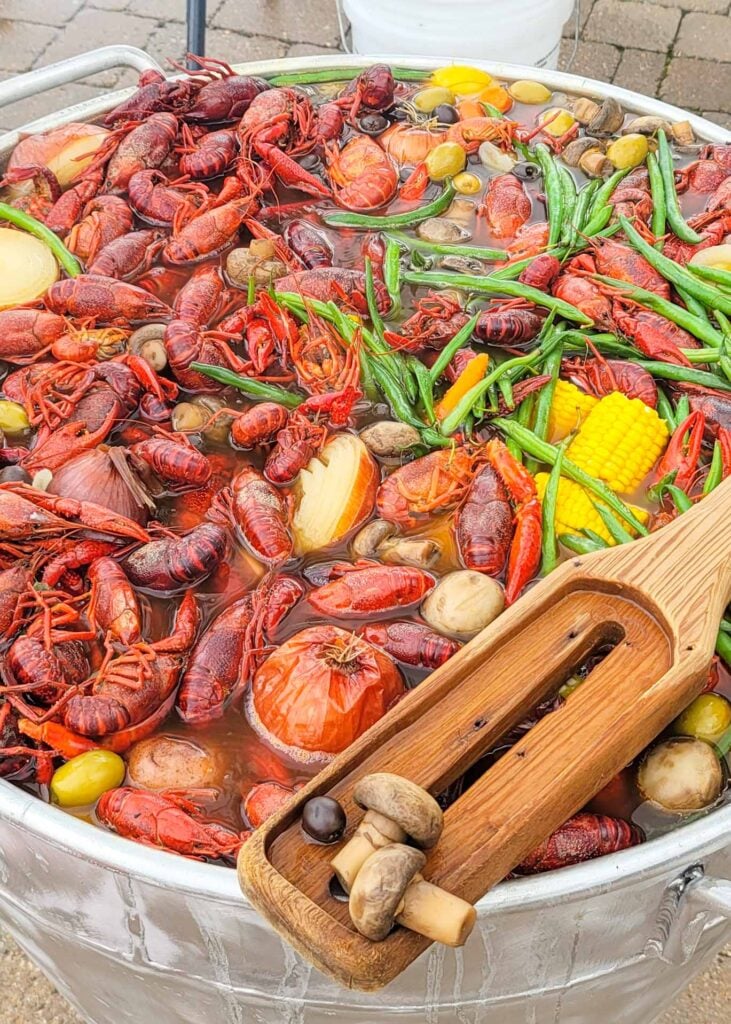 close up of louisiana boil with crawfish and vegetables