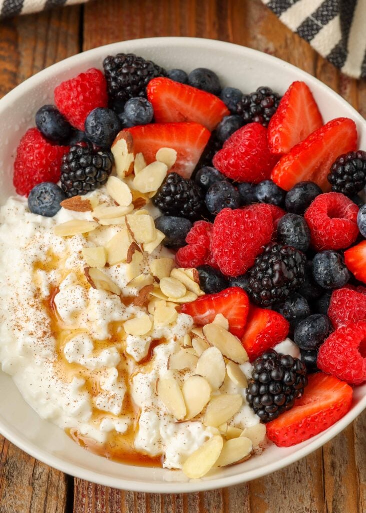 Cottage cheese, berries and fruit drizzled with honey