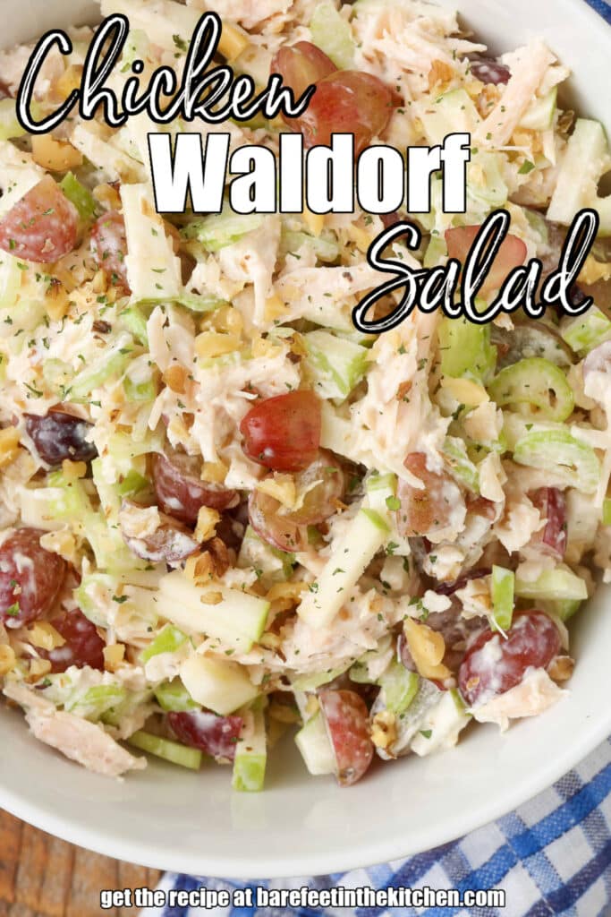 White lettering has been overlaid this top down photo of a bowl of chicken waldorf salad. It reads, "Chicken Waldorf Salad".