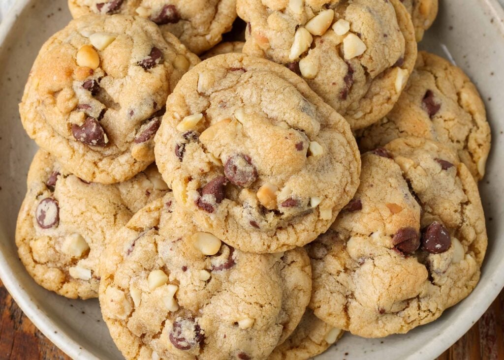 a pile of chocolate chip macadamia nut cookies