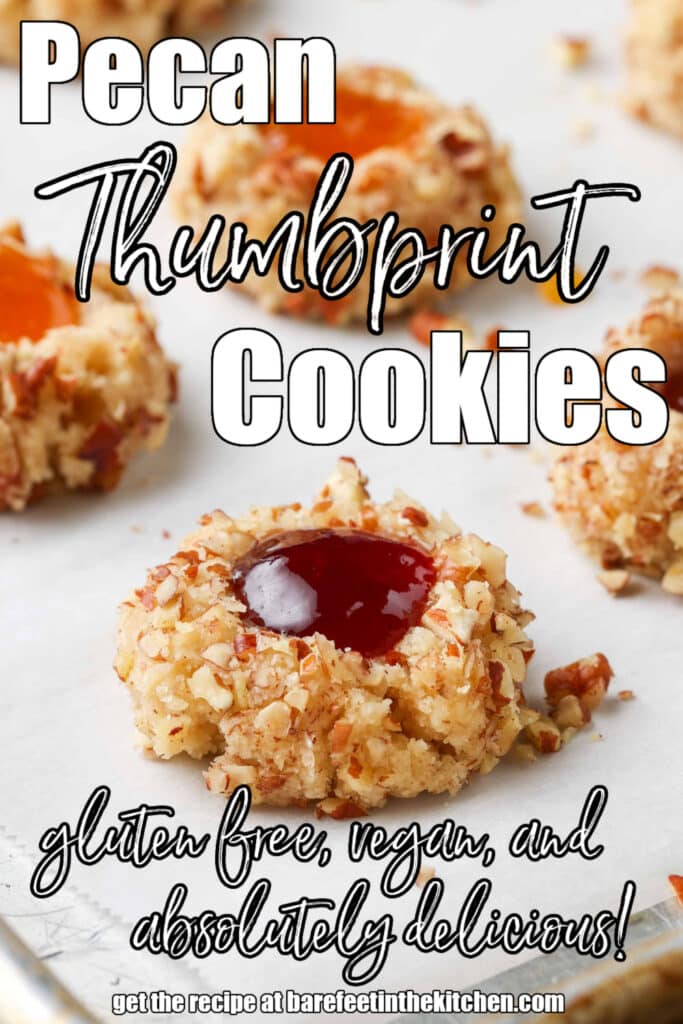 white lettering has been overlaid this image of gluten free, jam-filled pecan thumbprint cookies are arrayed on a white serving dish over a colorful tea towel. it reads, 