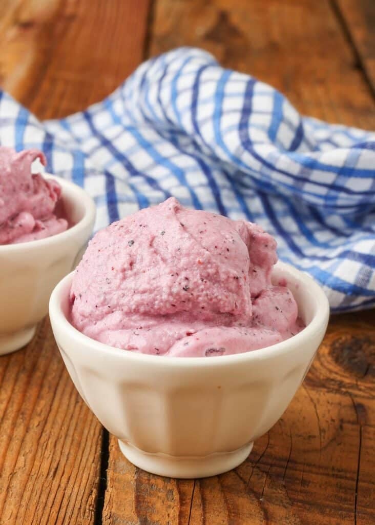 Pink soft serve in white bowl