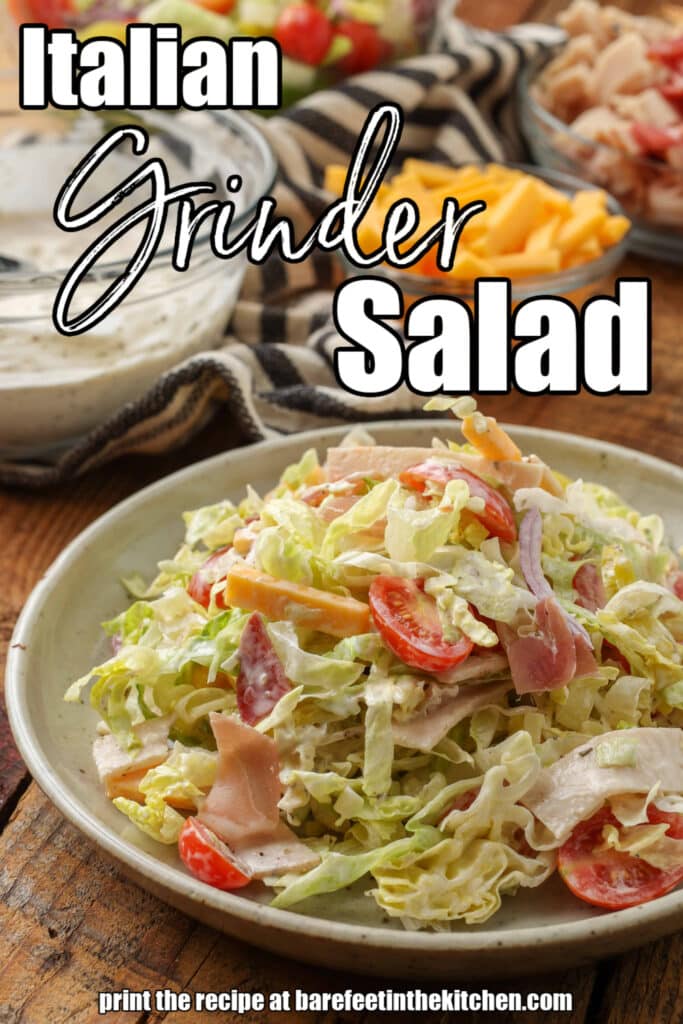 grinder salad on plate next to bowls of ingredients