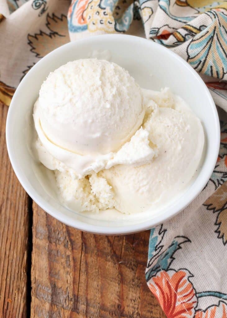 creamy eggless ice cream scooped into white bowl