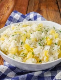white bowl holding rice with pineapple