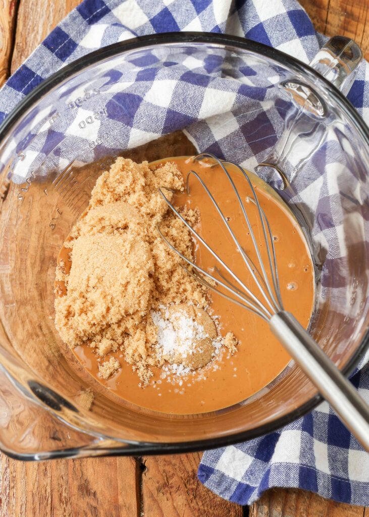 melted cookie butter, brown sugar, and salt in a mixing bowl with whisk