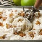 scoop of homemade ice cream in pan with apples