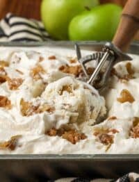 scoop of homemade ice cream in pan with apples