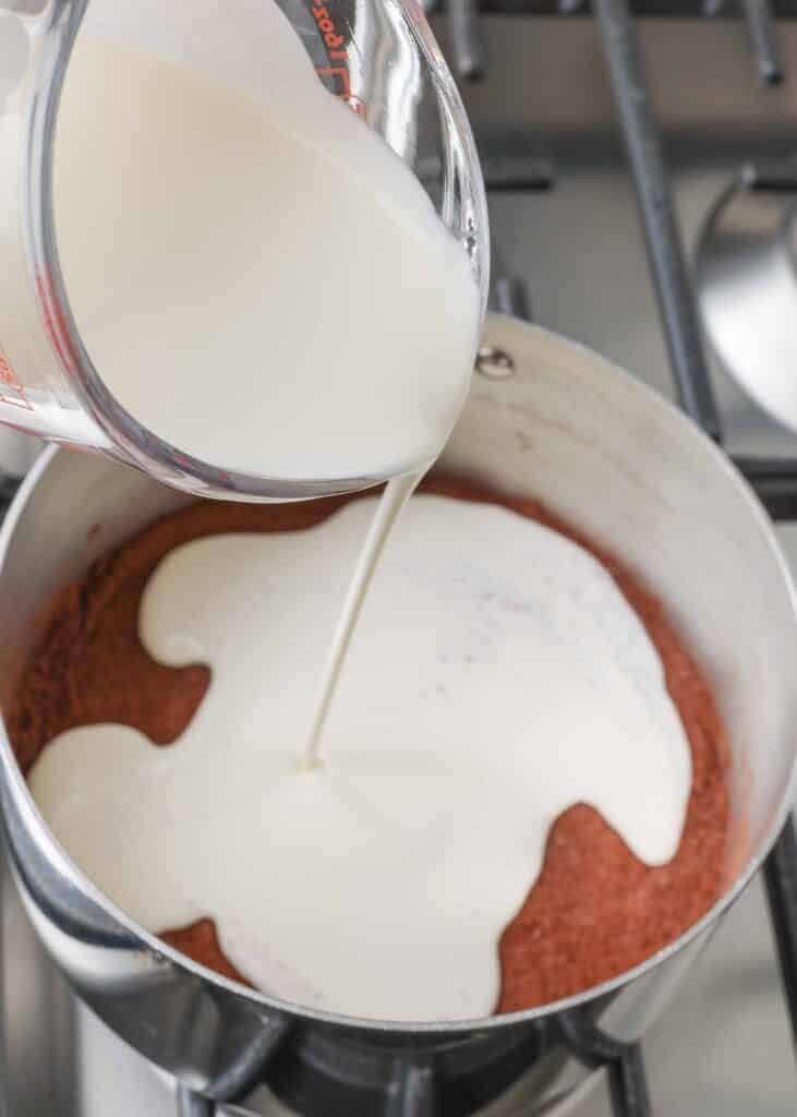 pouring cream into chocolate ice cream base