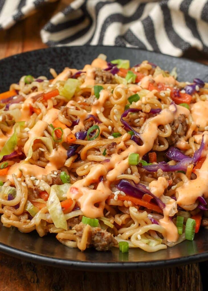 close up photo of noodle stir fry with sauce