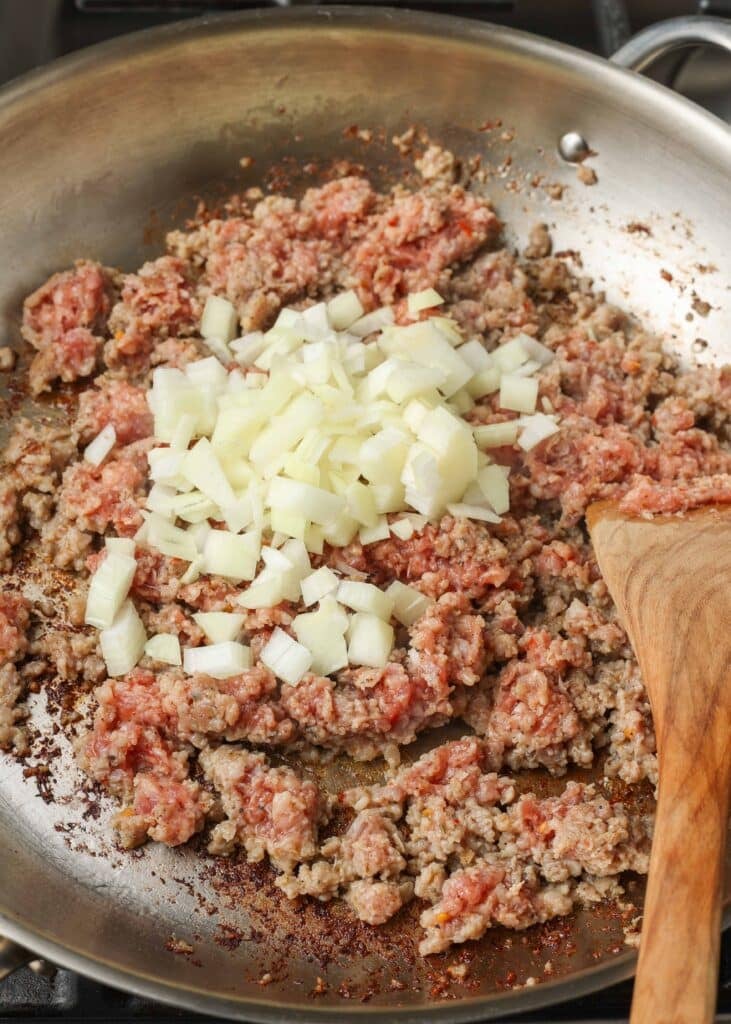 ground sausage and onion in skillet