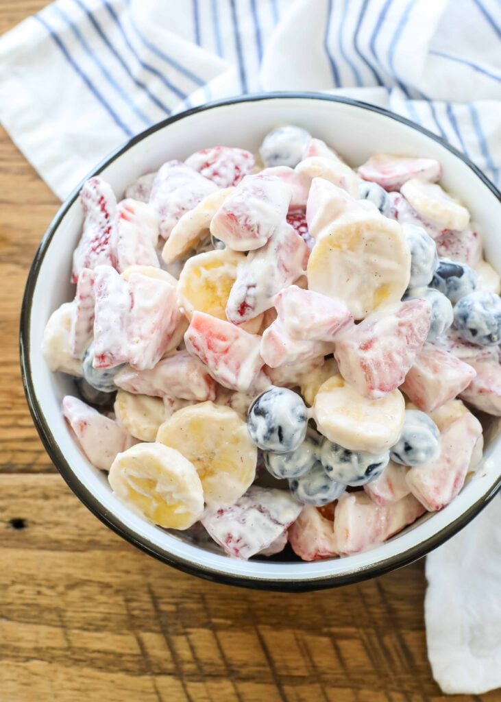 Creamy Fruit Salad with berries and bananas is a light side dish for summer barbecues!