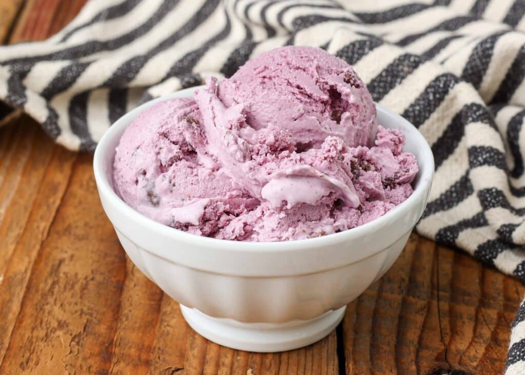 small white bowl with raspberry ice cream