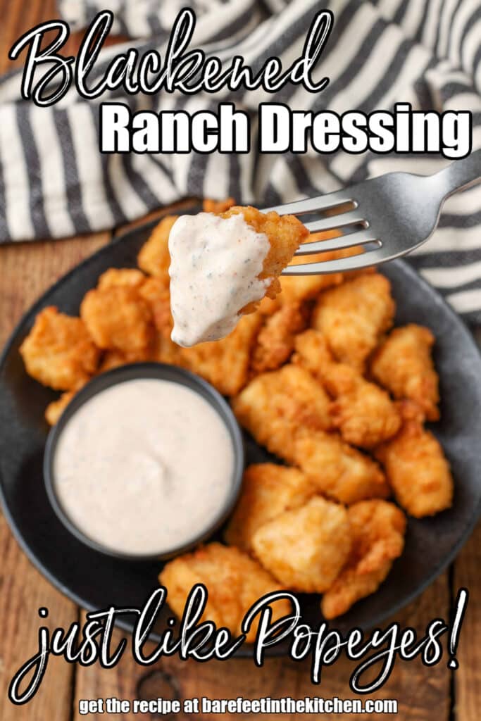 chicken chunk on a fork, dipped in blackened ranch dip