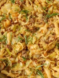 close up of sausage pasta with cabbage
