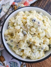 Best Ever Potato Salad with plenty of eggs, pickles, and olives.