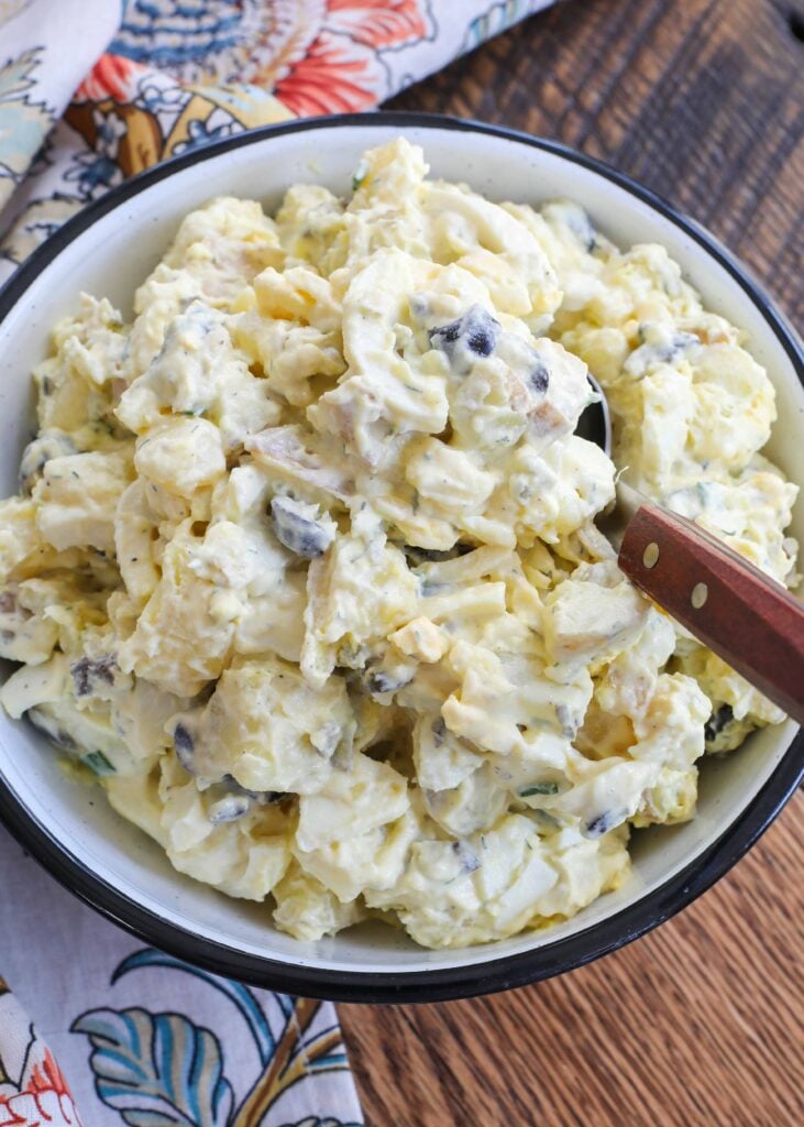 Best Ever Potato Salad is loaded with eggs, tart pickles and olives.