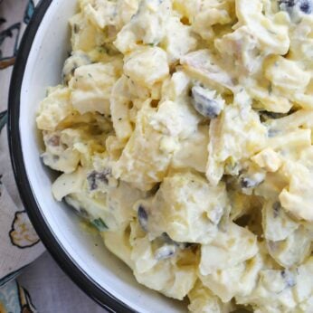 Creamy egg filled potato salad is a potluck favorite!