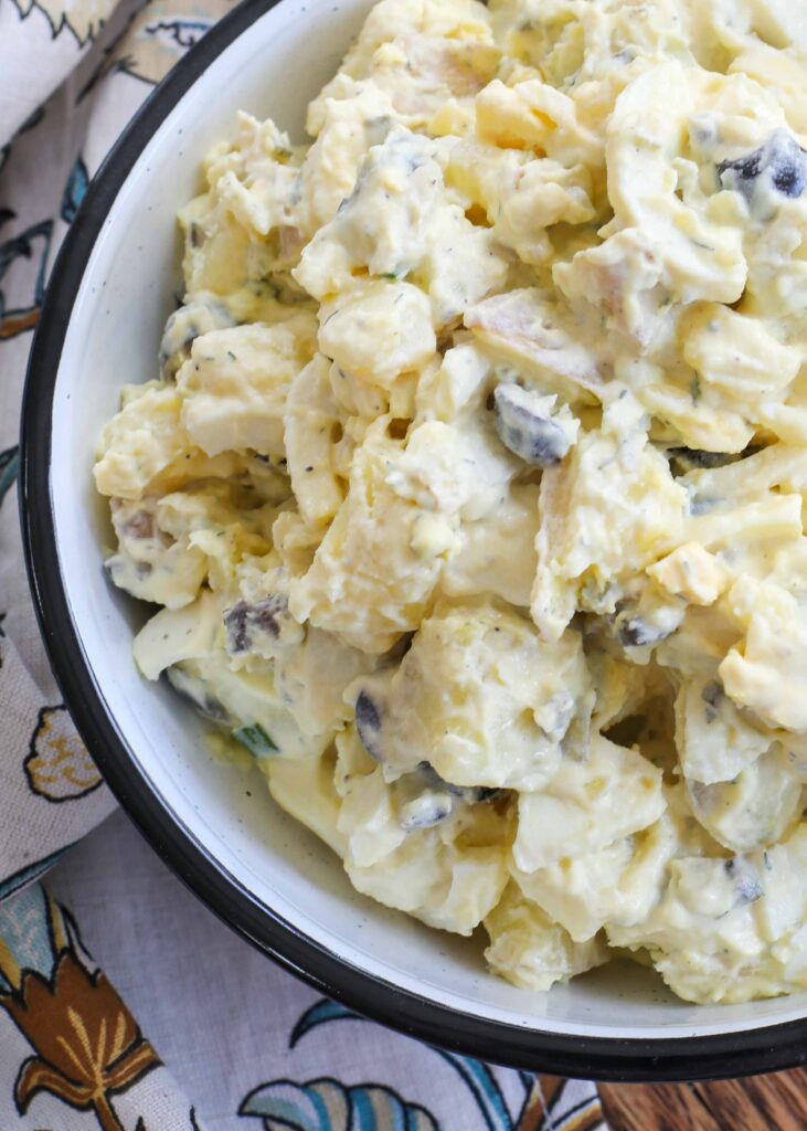 Creamy egg filled potato salad is a potluck favorite!