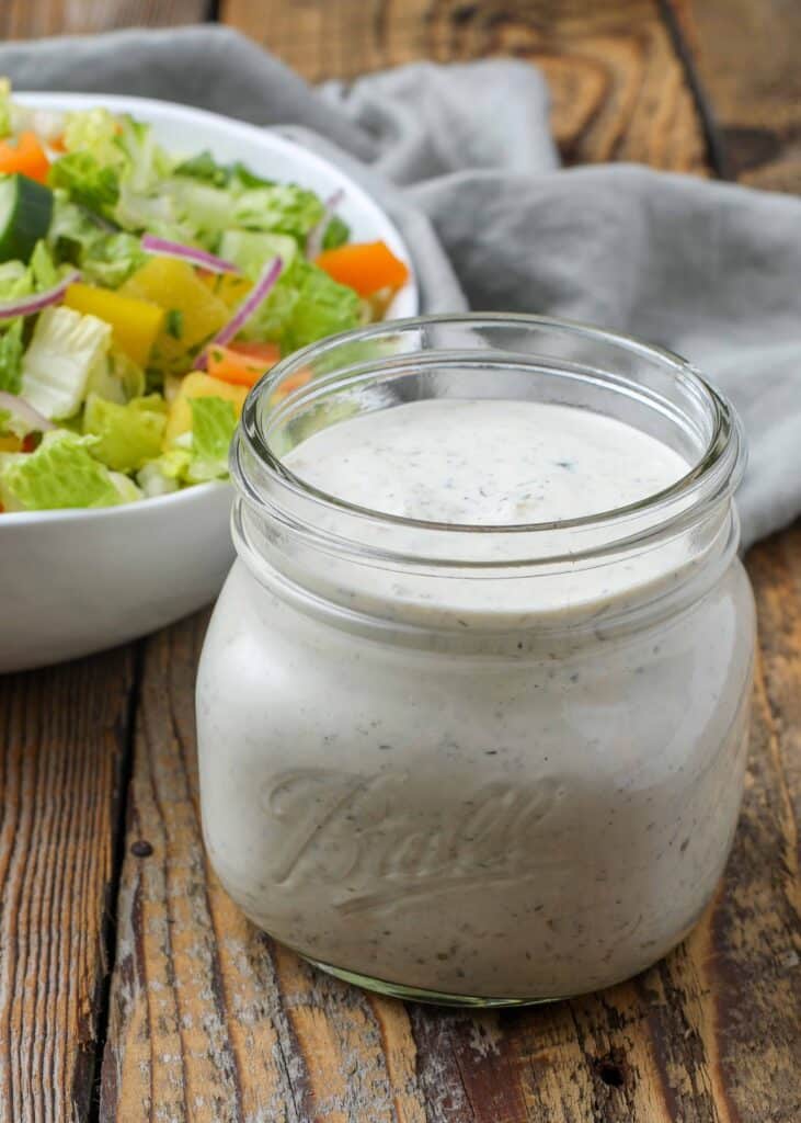 ranch dressing in jar on wooden table