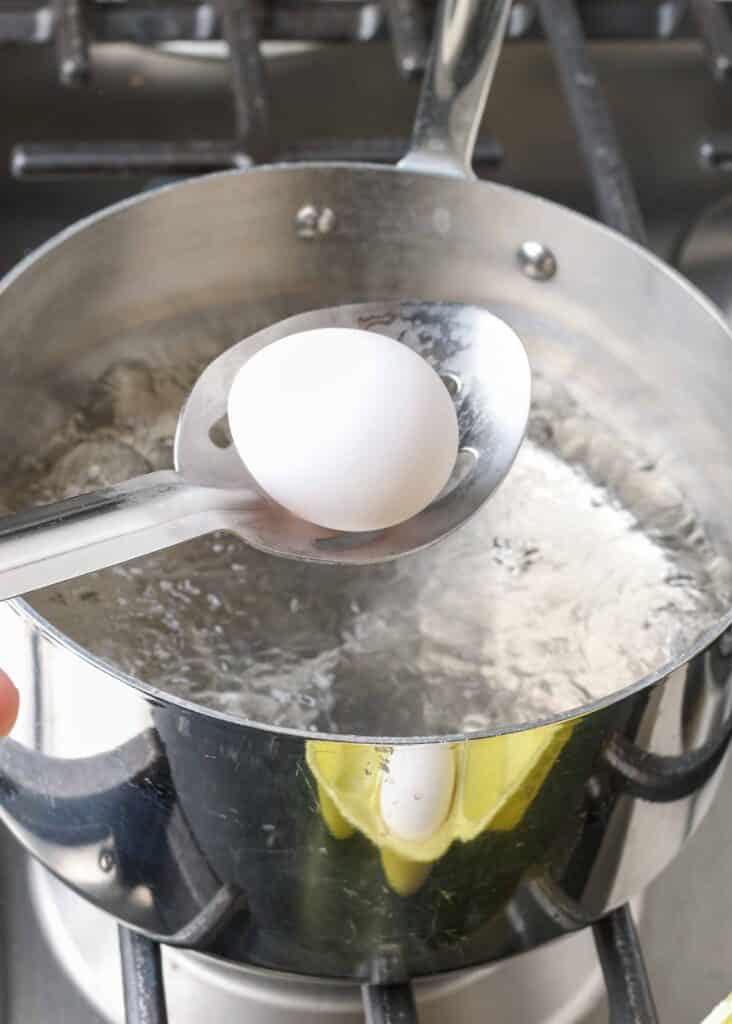 Egg above pot of boiling water