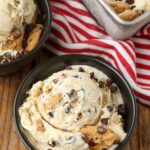 close up photo of chips ahoy ice cream in small black bowls
