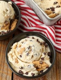 close up photo of chips ahoy ice cream in small black bowls