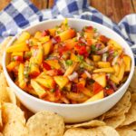 diced peaches, onion, and jalapeno salsa in white bowl