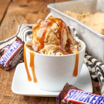 peanut butter ice cream with chunks of snickers candy bars and a caramel swirl