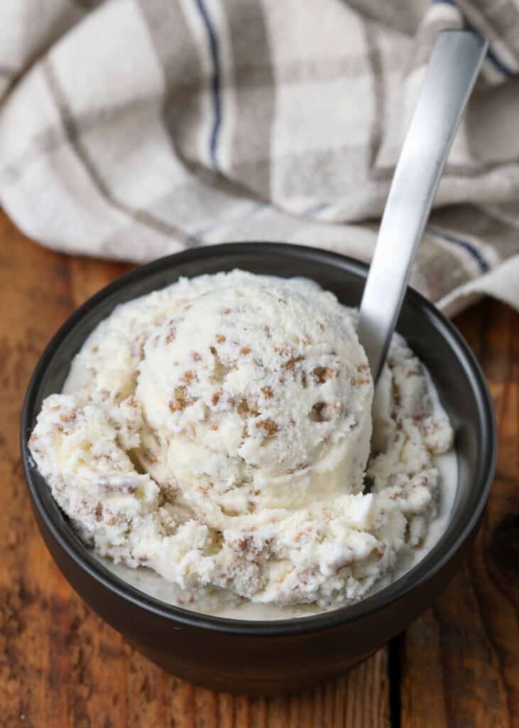 Jamaican ice cream in small bowl with silver spoon on wooden table