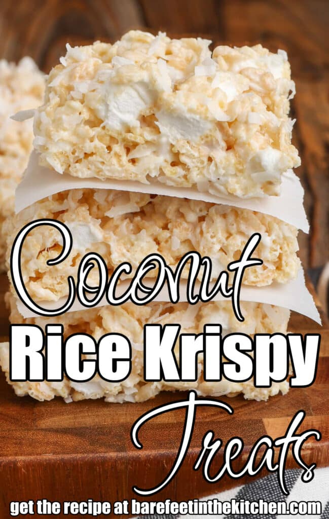 Coconut Rice Krispy Treats stacked on wooden board