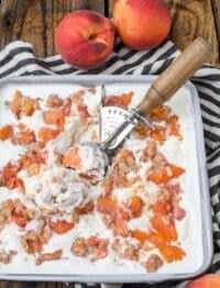 peach crisp ice cream in pan with scoop