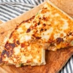 Teriyaki Chicken Quesadillas on Wooden Cutting Board with striped towel