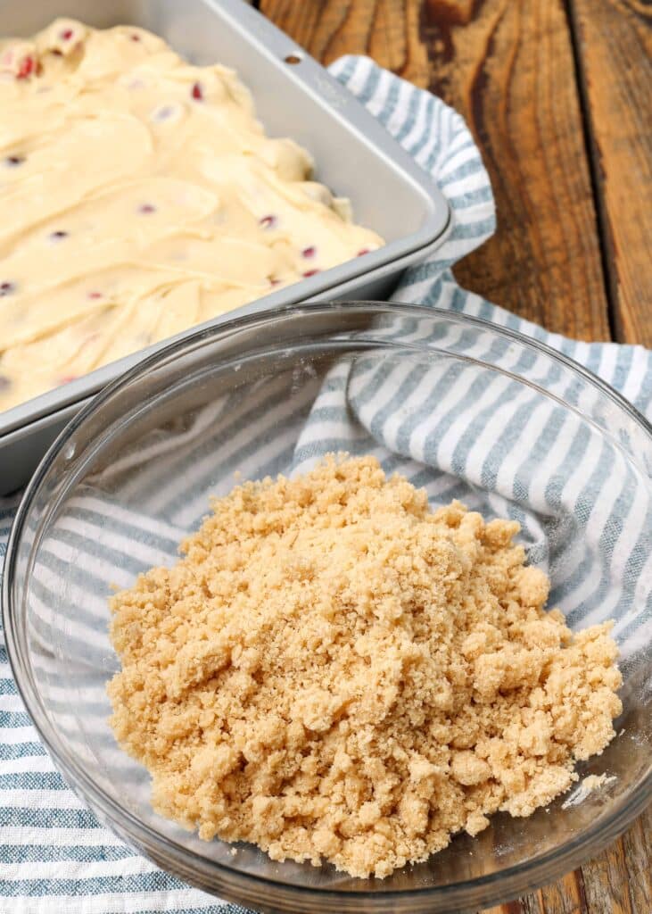 cranberry cake batter with streusel in square pan