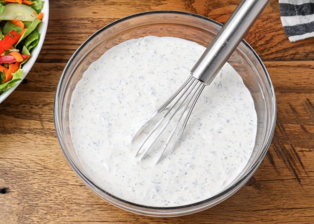 dill pickle ranch in bowl with whisk on table - 9