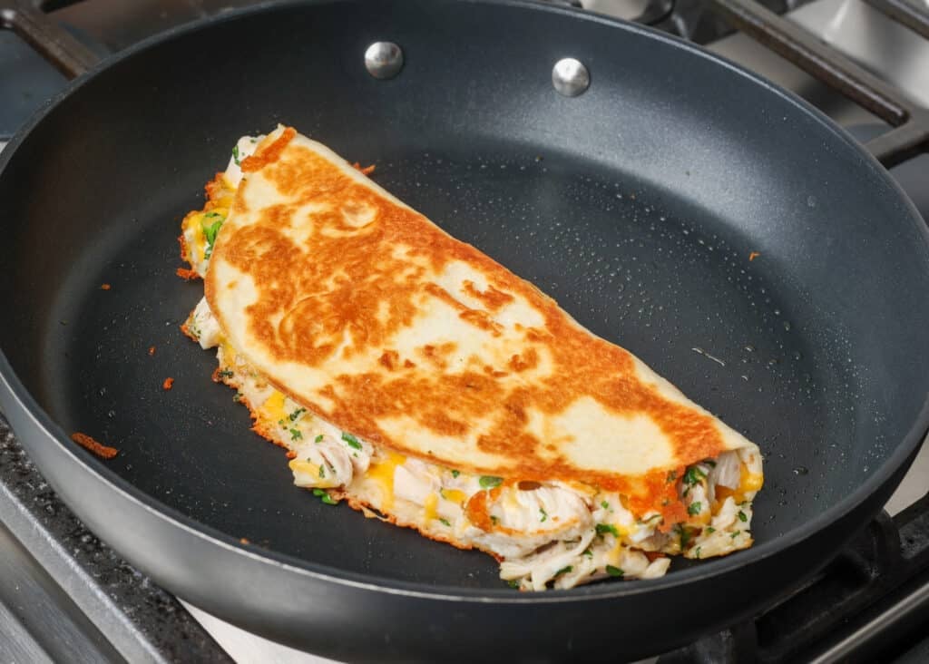 finished chicken quesadilla in skillet