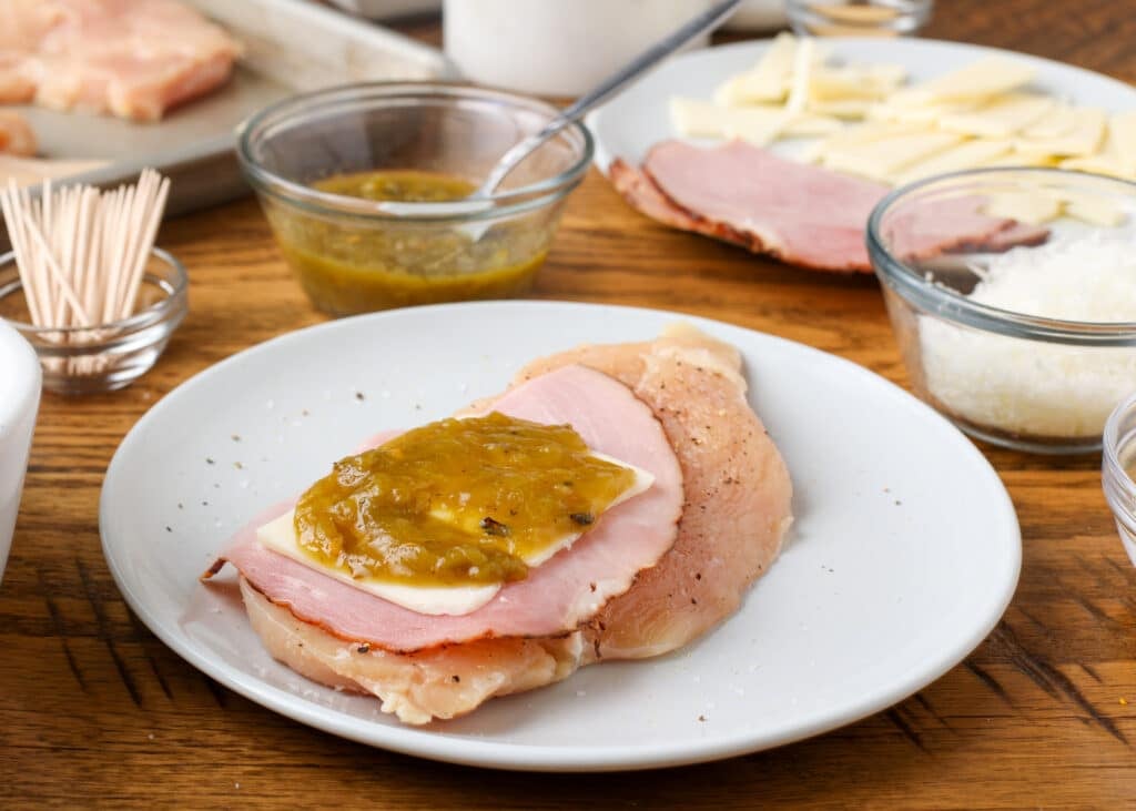 The assembled cordon blue with green chile on top is ready to roll and pin.