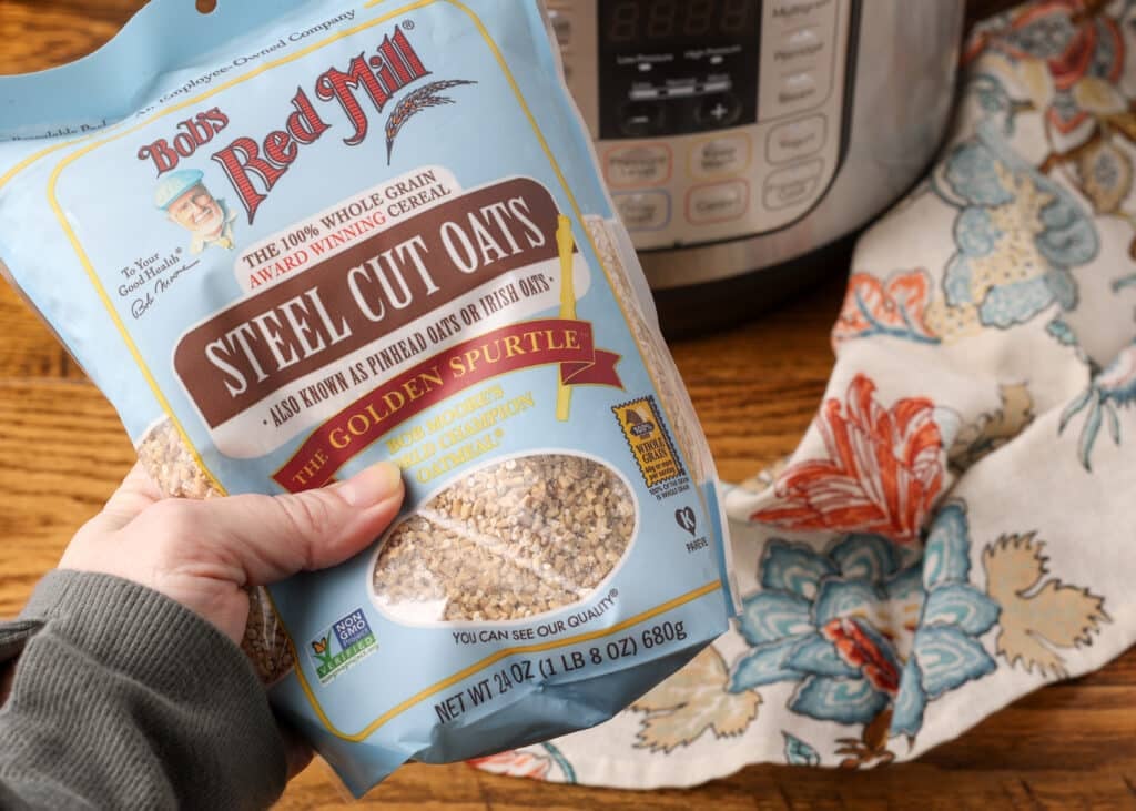 bag of steel cut oats held in hand