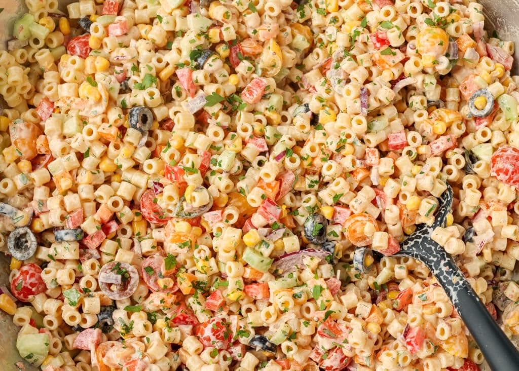 The final salad is ready to eat, stirred together and coated in dressing.