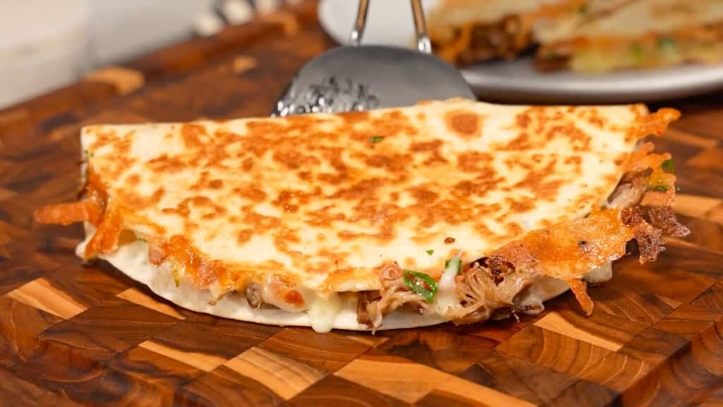 transferring quesadilla to cutting board