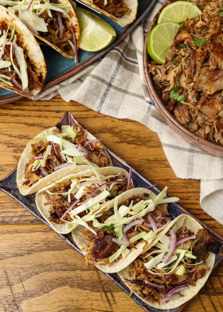 tacos topped with everything on platter