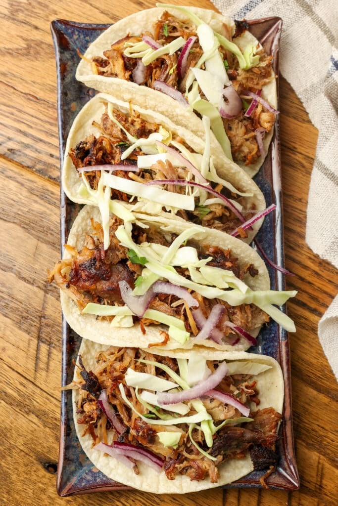 stacked street tacos on rectangular platter
