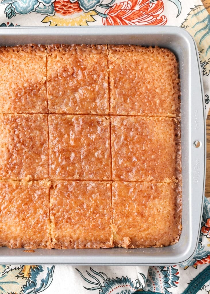 The cake has been sliced in the pan and is ready to serve.