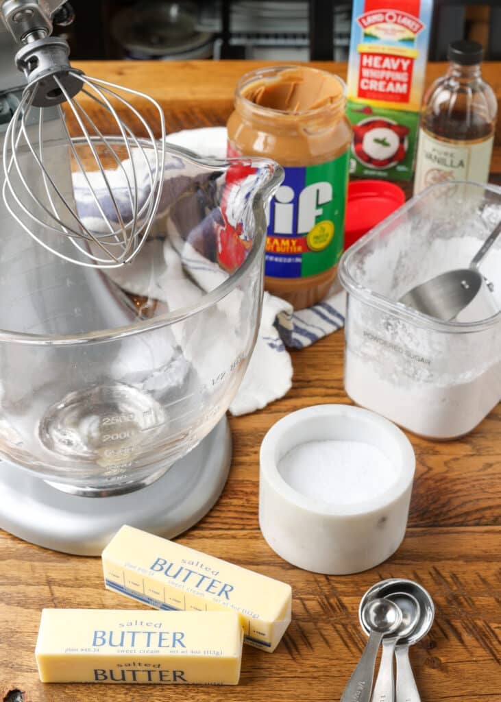 All the ingredients for the frosting are arrayed around a stand mixer.