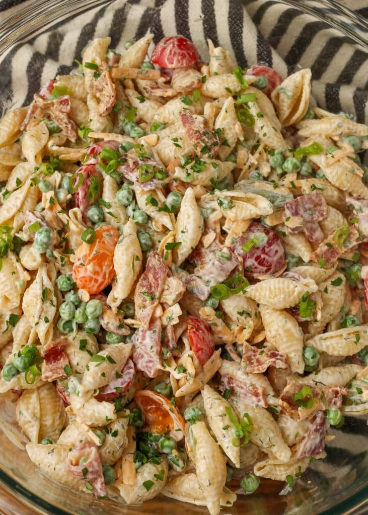 close up of pasta salad stirred together with dressing