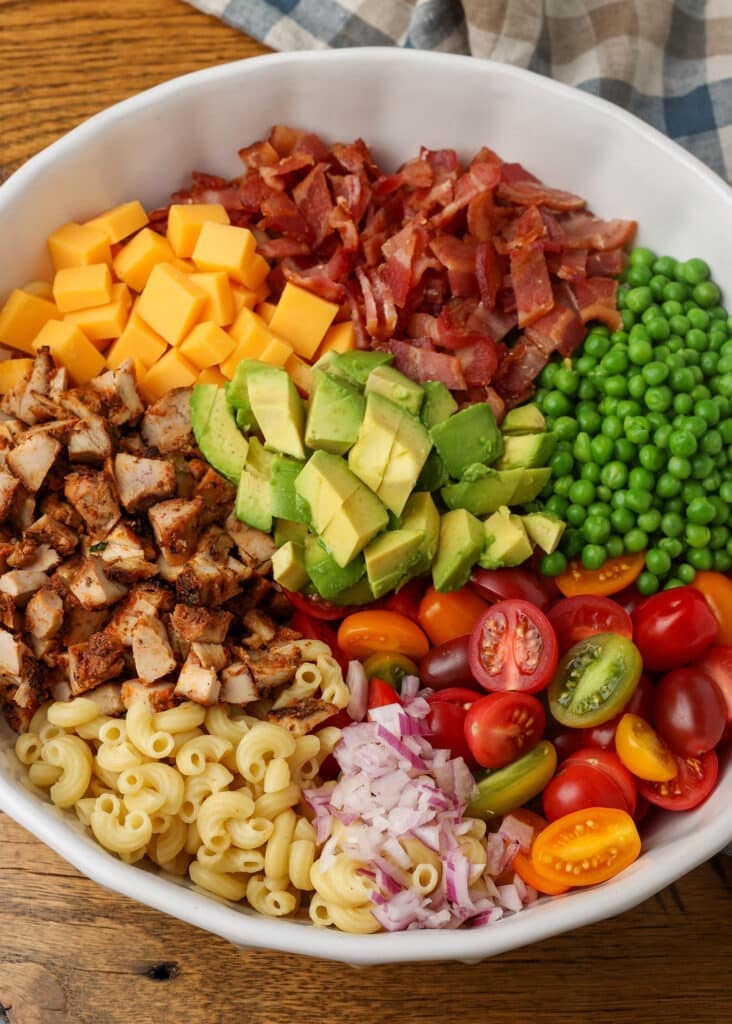 The ingredients are arrayed but not yet mixed, a beautiful assortment of reds, oranges, and green.