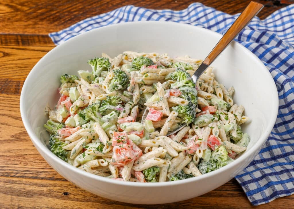 pasta salad all combined with serving spoon