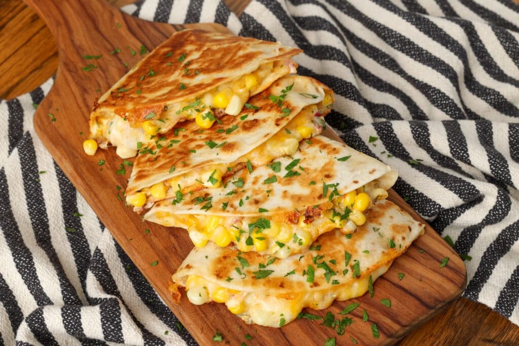 sliced quesadilla on board